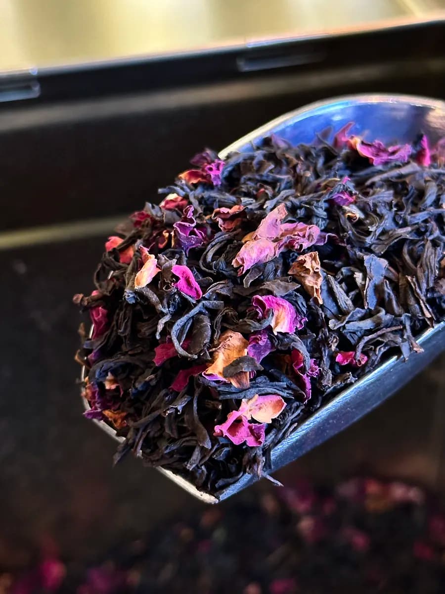 Close-up of black tea with rose petals — Dear Robert signature blend composition